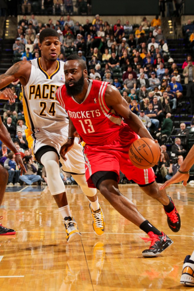 INDIANAPOLIS, IN - JANUARY 18: James Harden #13 of the Houston Rockets drives ahead of Paul George #24 of the Indiana Pacers on January 18, 2013 at Bankers Life Fieldhouse in Indianapolis, Indiana.  NOTE TO USER: User expressly acknowledges and agrees that, by downloading and or using this photograph, user is consenting to the terms and condition of the Getty Images License Agreement. Mandatory Copyright Notice: 2013 NBAE  (Photo by Ron Hoskins/NBAE via Getty Images)